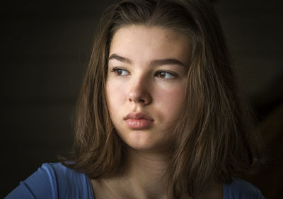 Close-up of thoughtful girl looking away