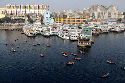 High angle view of river and buildings in city