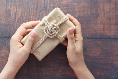 Close-up of woman hand holding wood