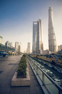 View of city buildings against clear sky