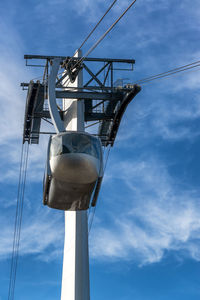 Low angle view of crane against sky