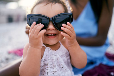 Portrait of cute girl wearing sunglasses