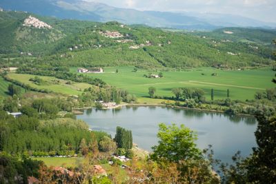 Scenic view of landscape and lake against mountains