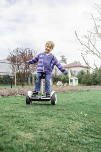 Portrait of boy on hoverboard