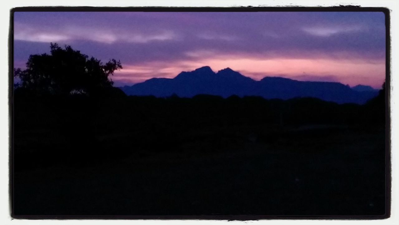 silhouette, mountain, transfer print, tranquil scene, scenics, tranquility, beauty in nature, sky, sunset, mountain range, landscape, auto post production filter, nature, tree, idyllic, dark, dusk, cloud - sky, cloud, non-urban scene