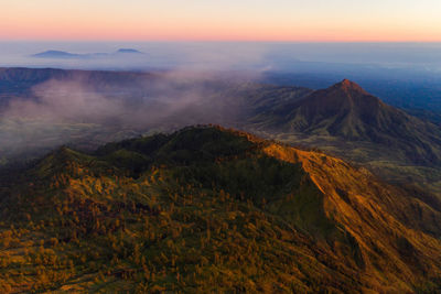 Scenic view of mountains against sky during sunset