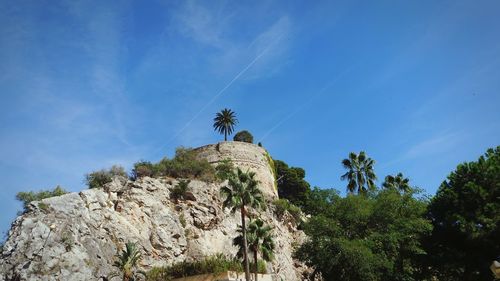 Low angle view of rock formation against sky