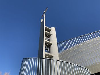 Low angle view of modern building against clear blue sky