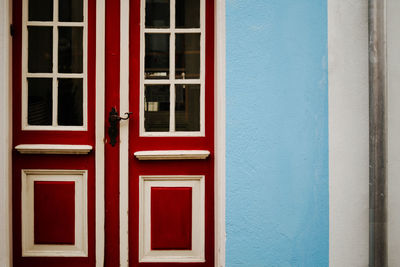 Closed red door of house