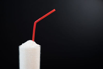 Close-up of drink against black background