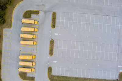 High angle view of yellow painted on wooden fence