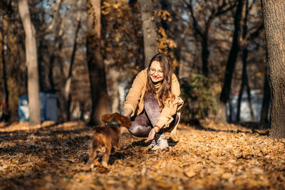 Improving dogs immune system. boost puppy immune system. happy woman walking with cocker spaniel