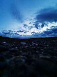 Surface level of land against blue sky