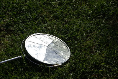 High angle view of drinking glass on field