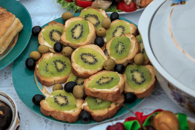 High angle view of kiwi sandwich in plate on table