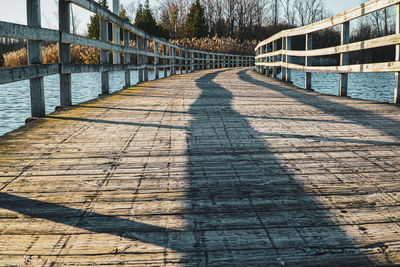 Shadow of bridge on footpath