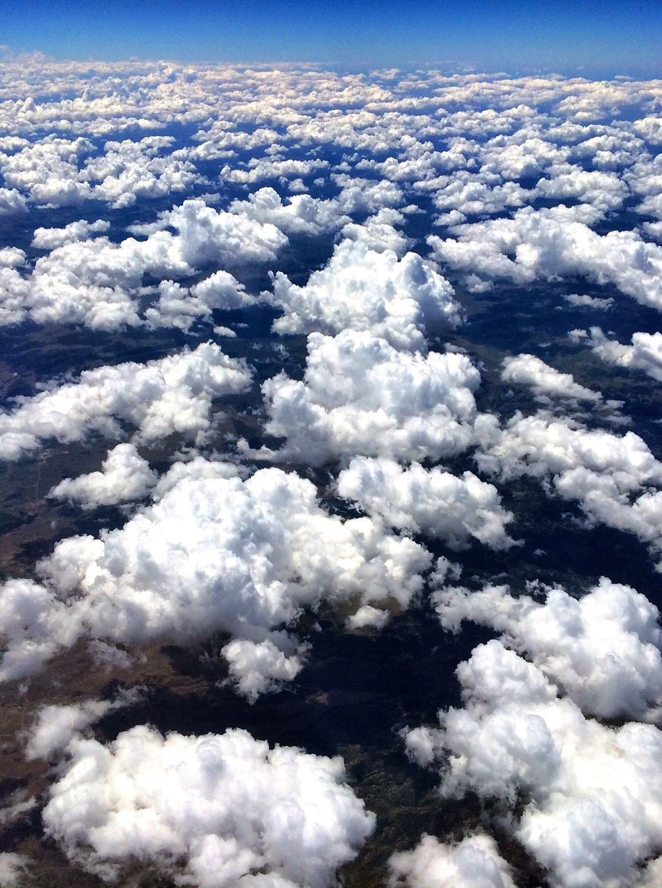 sky, beauty in nature, cloud - sky, cloudscape, scenics, white color, aerial view, nature, tranquil scene, tranquility, sky only, cloud, blue, fluffy, white, cloudy, softness, idyllic, majestic, weather