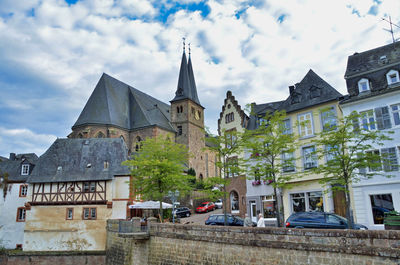 Street amidst buildings in city against sky