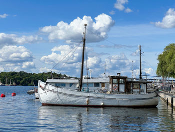 Boats in sea against sky