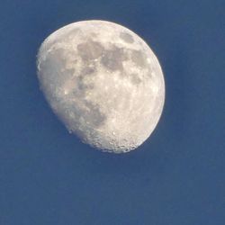 Low angle view of half moon against sky at night