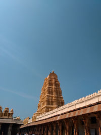 Low angle view of historical building against clear blue sky