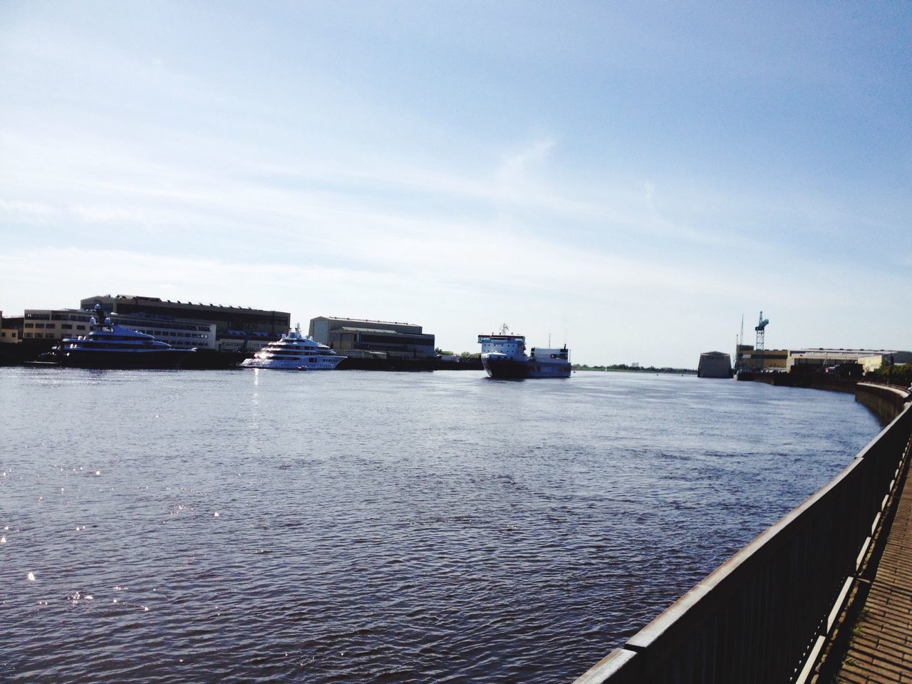 transportation, sky, water, built structure, architecture, sea, mode of transport, nautical vessel, railing, river, building exterior, cloud - sky, connection, boat, no people, cloud, day, waterfront, bridge - man made structure, pier