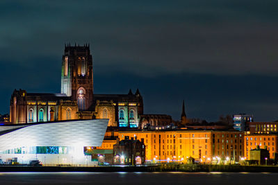 Illuminated buildings in city at night