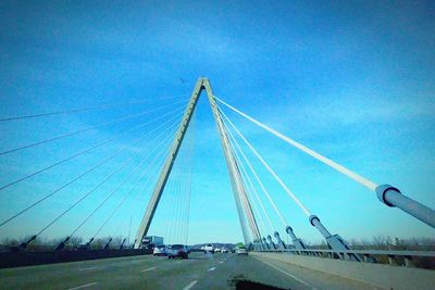 Suspension bridge against blue sky