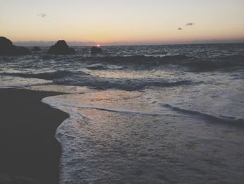 Scenic view of sea at sunset