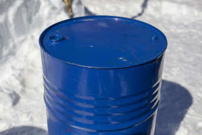 High angle view of blue container on table