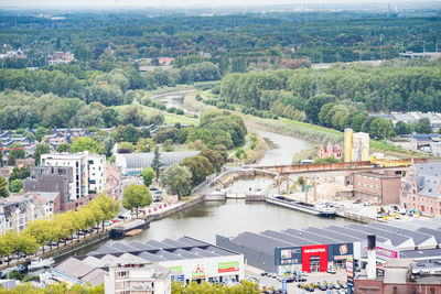 High angle view of river amidst buildings in city