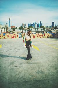 Full length of a man with cityscape in background