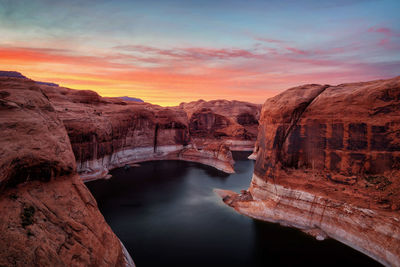 Scenic view of rock formation against sky during sunset