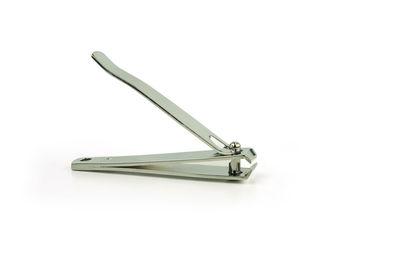 Close-up of nail cutter on white background