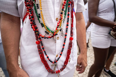 Candomble followers are seen wearing necklaces during the bonfim washing procession 