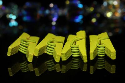 Close-up of text on yellow paper over table