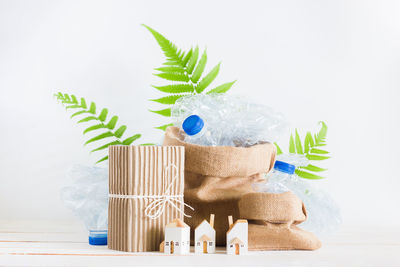 Close-up of toys on table against white background