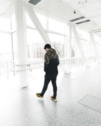 Full length of woman standing on floor