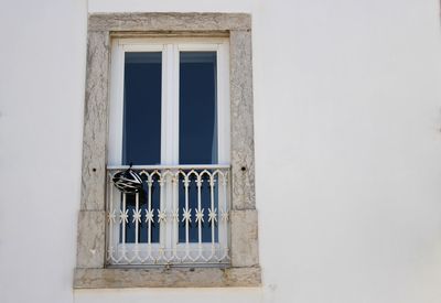Low angle view of window of old building