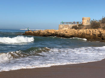 Scenic view of sea against clear sky