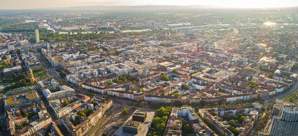 High angle view of illuminated street amidst buildings in city