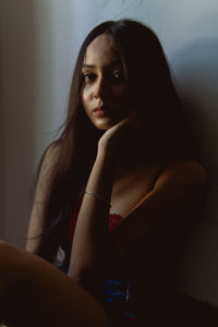 Portrait of beautiful woman sitting at home