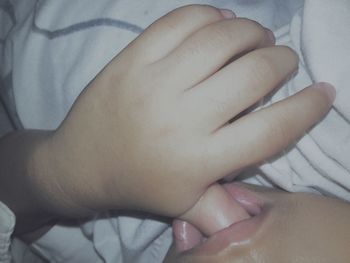 Full length of baby lying on bed