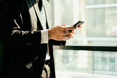 Close-up of man using mobile phone