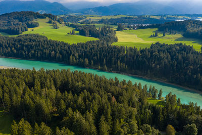 Aerial view of river lech with alp mountains in background on summer day