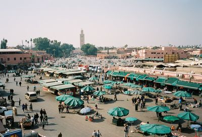 High angle view of people on street in city against clear sky