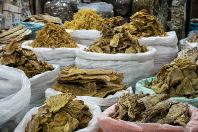 Stack of dried for sale at market stall