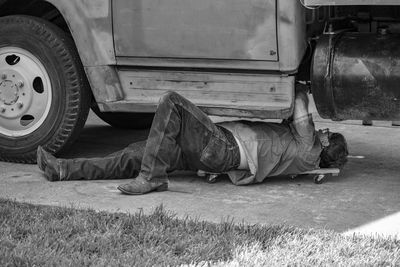 Man repairing vehicle