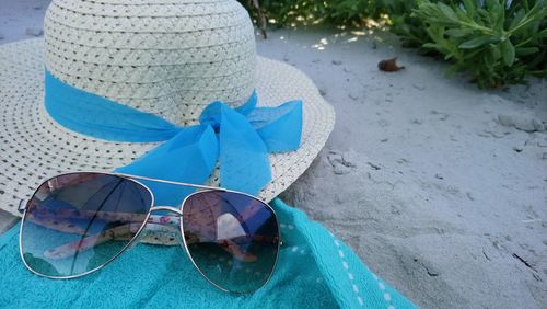 High angle view of sunglasses on shoes