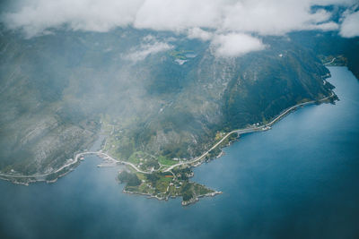 Aerial view of mountain by sea